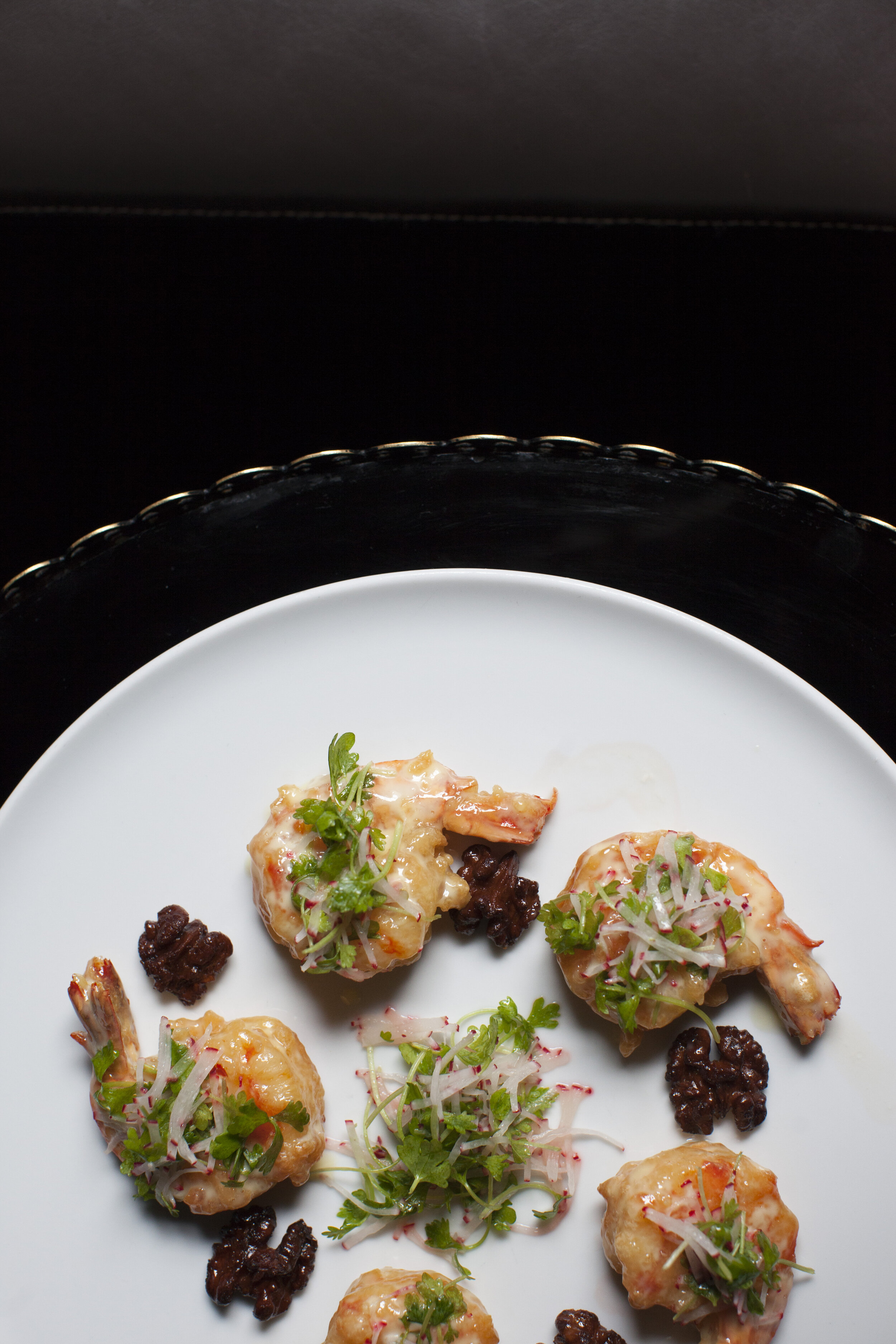 over head shot of shrimp arranged on a plate