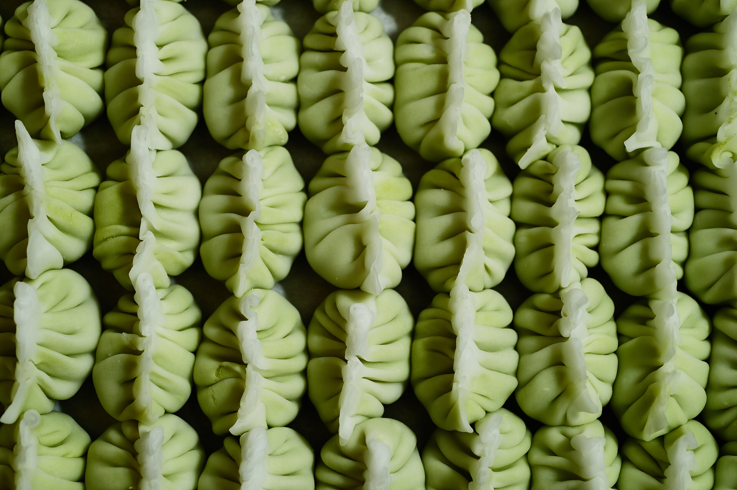 overhead shot of green dumplings 