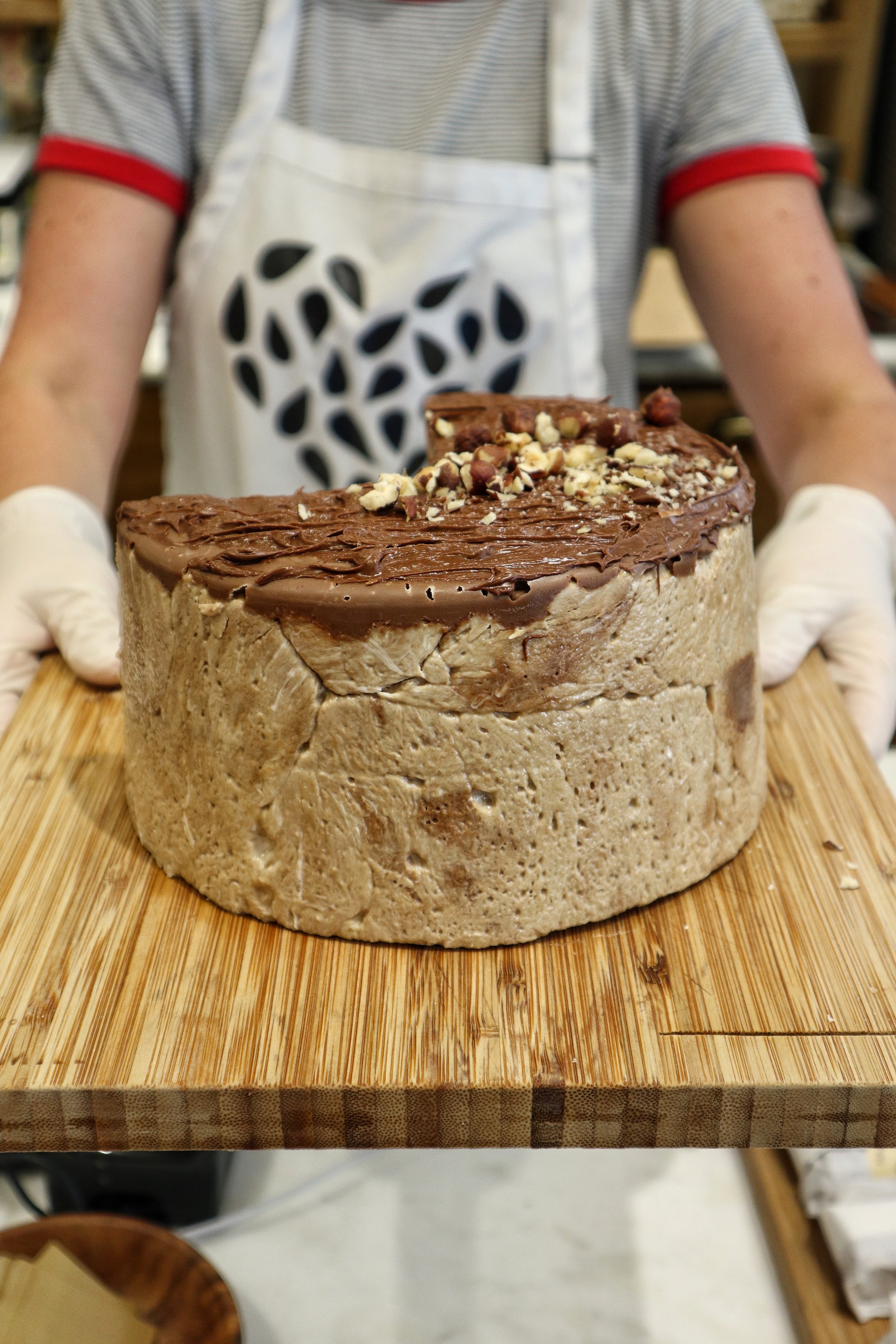 a cake of halva on a cutting board